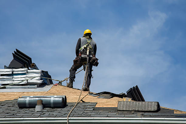 Professional Gutter Installation technician working in Pescadero, CA